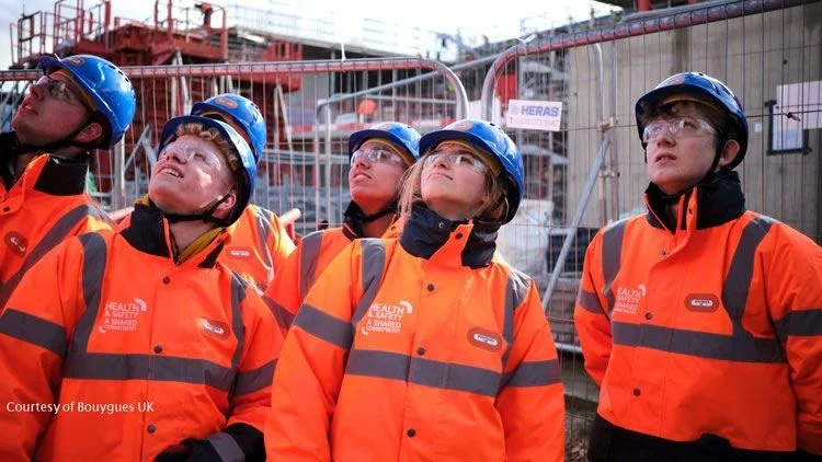 People on a construction site in hard-hats