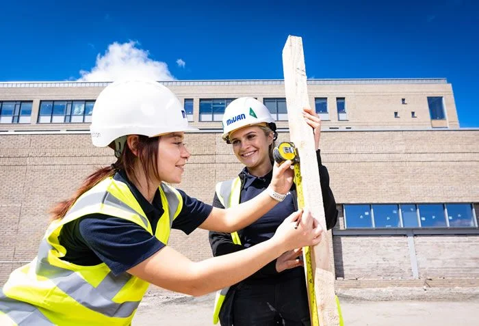 Woman on a construction site in a hard-hat